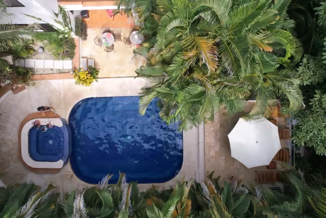 Aerial view of the pool, jacuzzi and loungers at Dreamcatcher Hotel