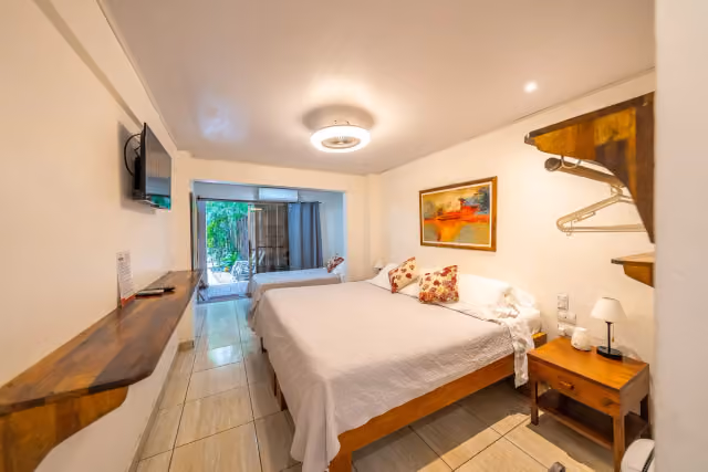 Bright guest room with garden view at Dreamcatcher Hotel