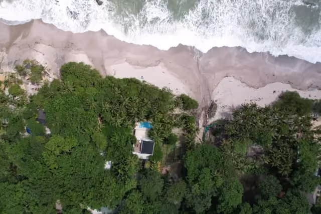 Aerial view of the Santa Teresa coastline near Dreamcatcher Hotel