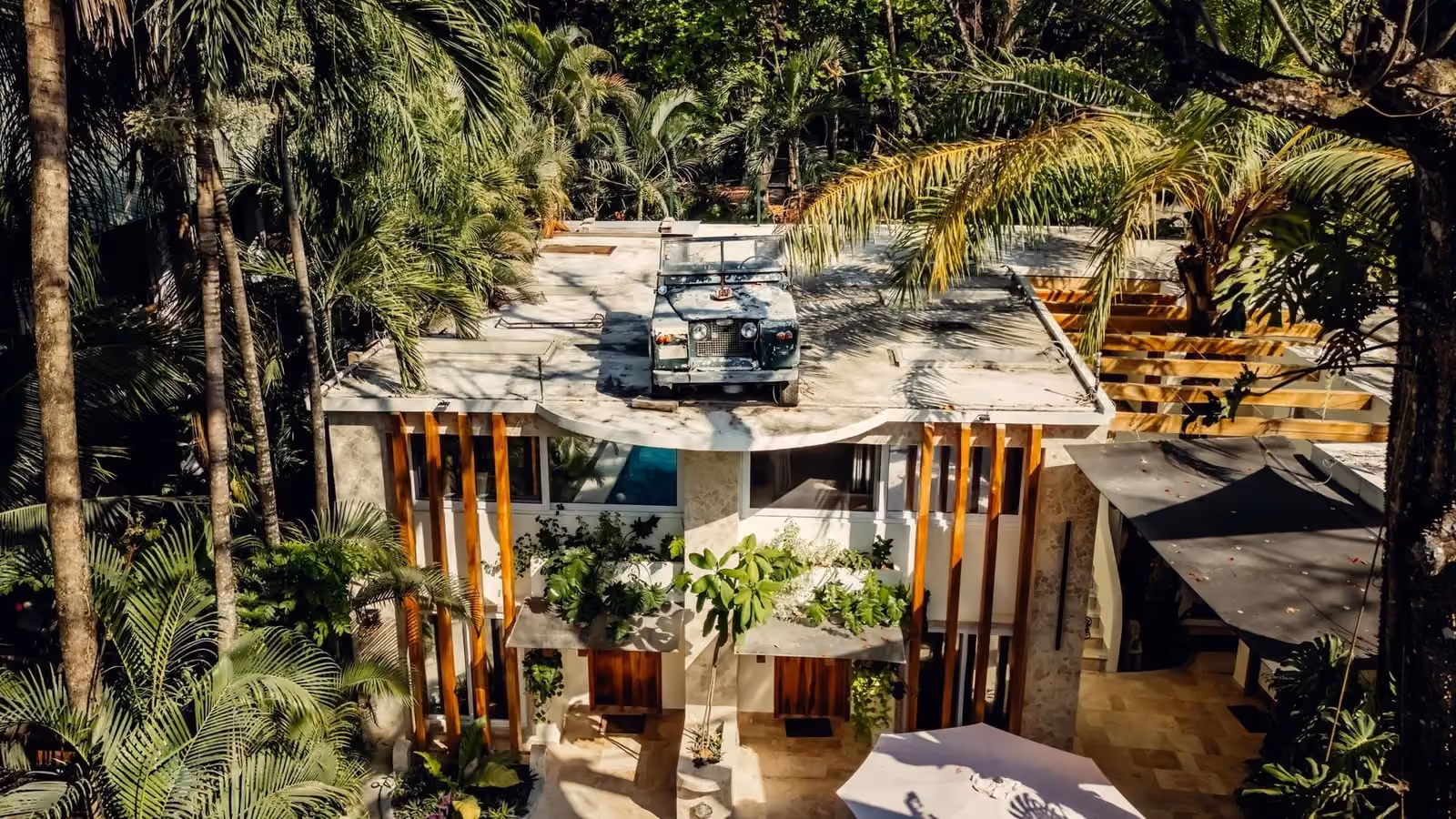 Dreamcatcher Hotel terrace and guest rooms surrounded by jungle in Santa Teresa