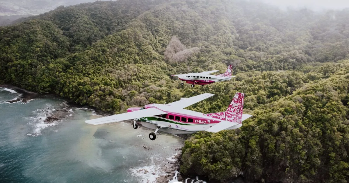 Two Costa Rica Green Airways aircraft flying over the Nicoya coastline